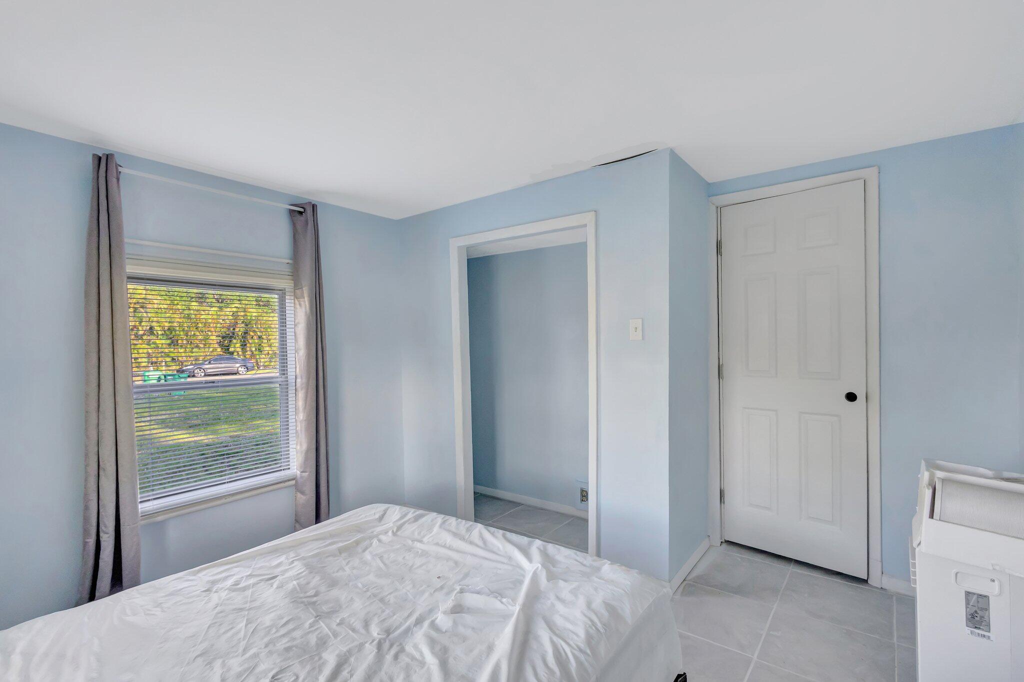 3539 Edwards Road Fort Pierce, FL 34981 - Photo 15 of 39 a bedroom with a bed and a window