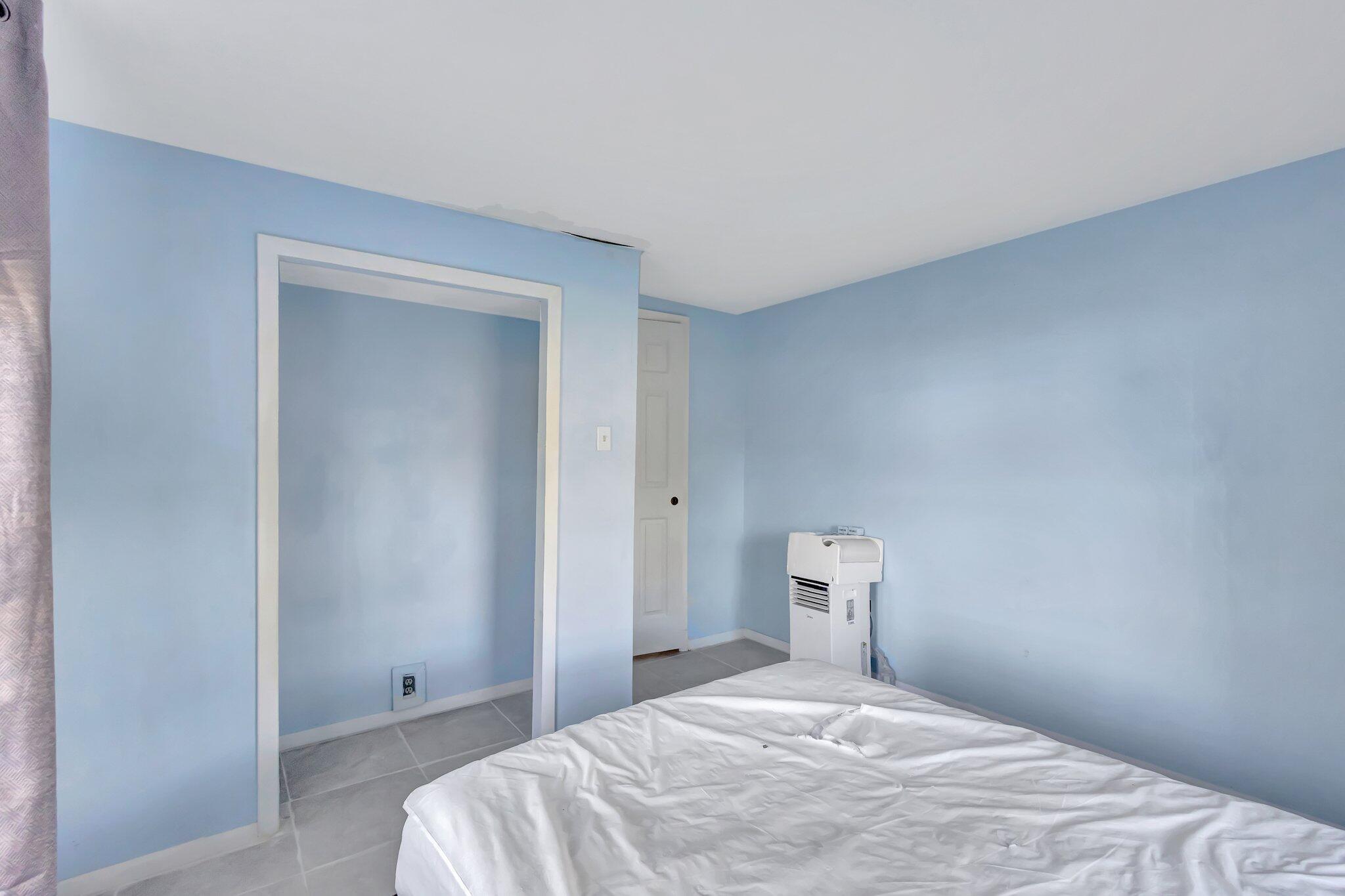 3539 Edwards Road Fort Pierce, FL 34981 - Photo 16 of 39 a bedroom with a bed and a window