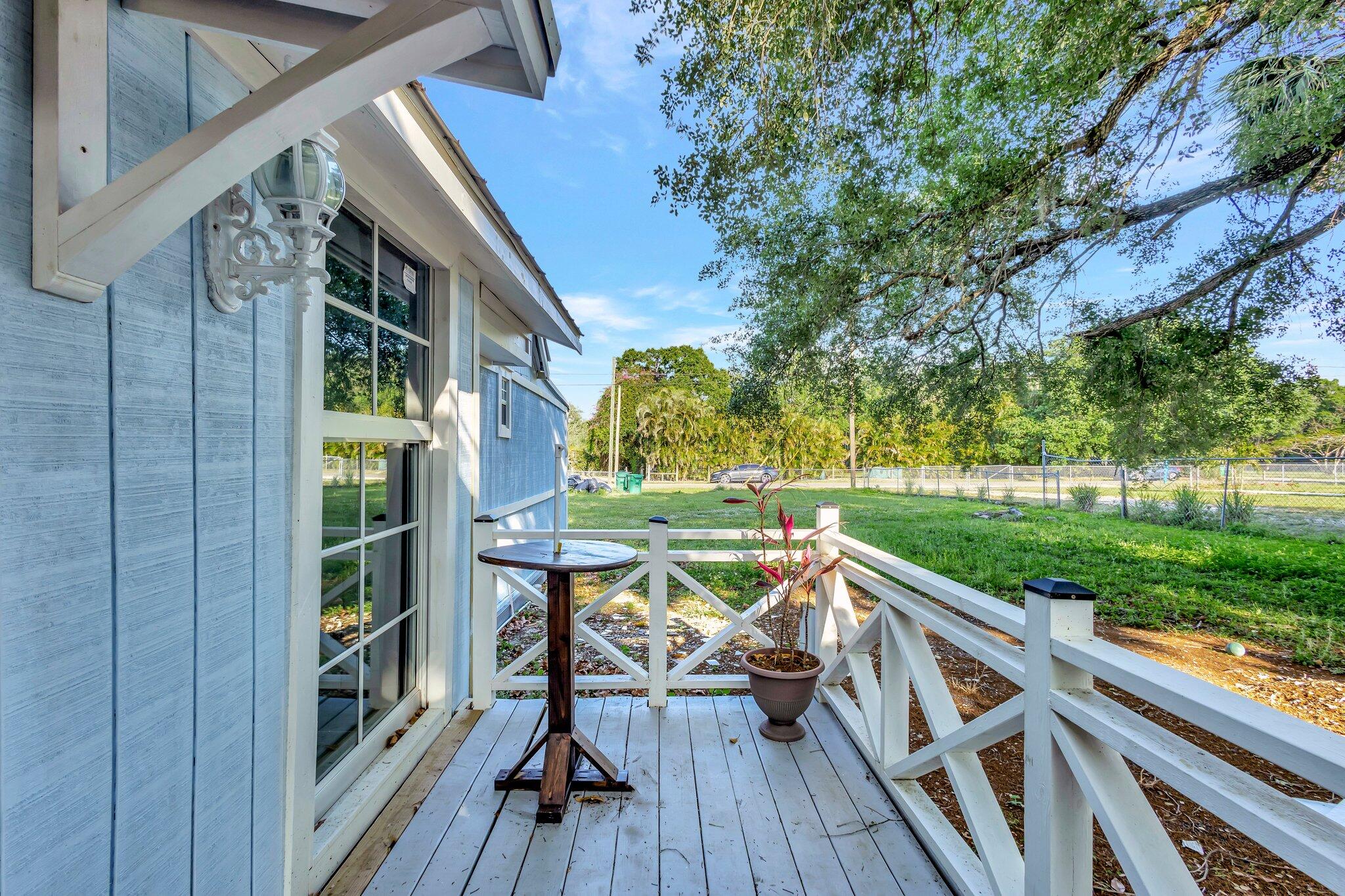 3539 Edwards Road Fort Pierce, FL 34981 - Photo 21 of 39 a view of deck with furniture and garden