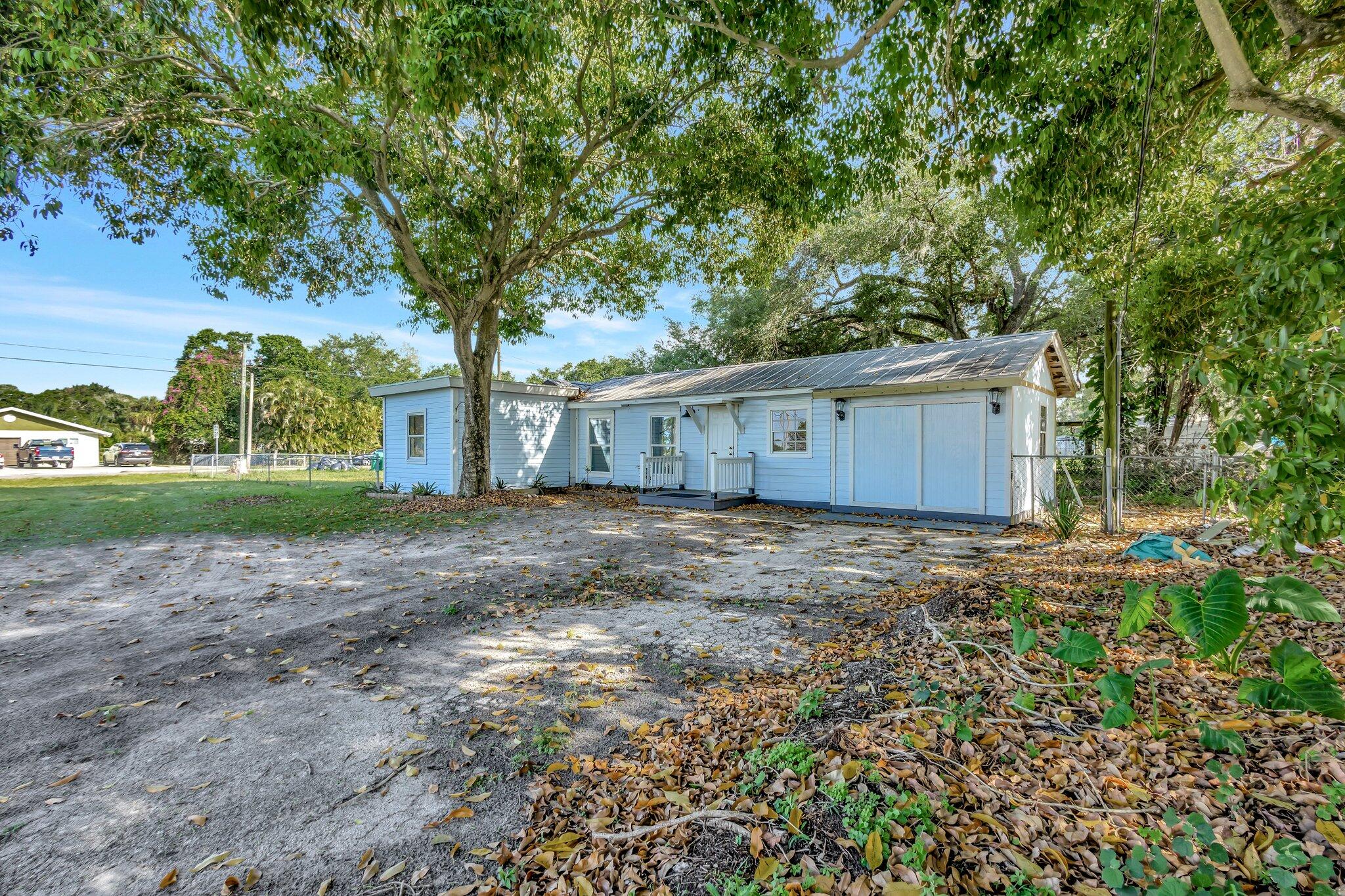 3539 Edwards Road Fort Pierce, FL 34981 - Photo 23 of 39 a view of a house with a garden