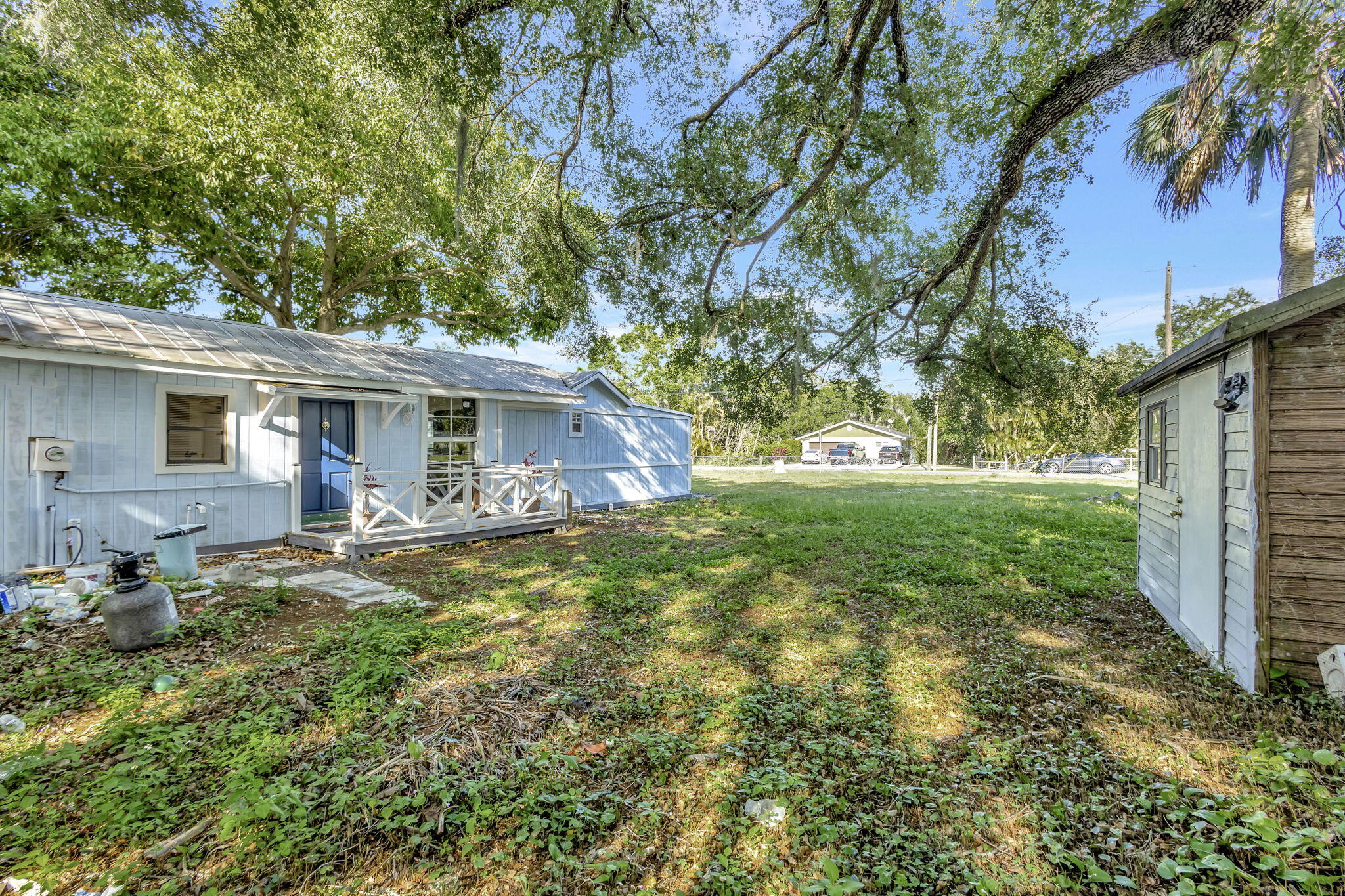 3539 Edwards Road Fort Pierce, FL 34981 - Photo 26 of 39 a backyard of a house with table and chairs
