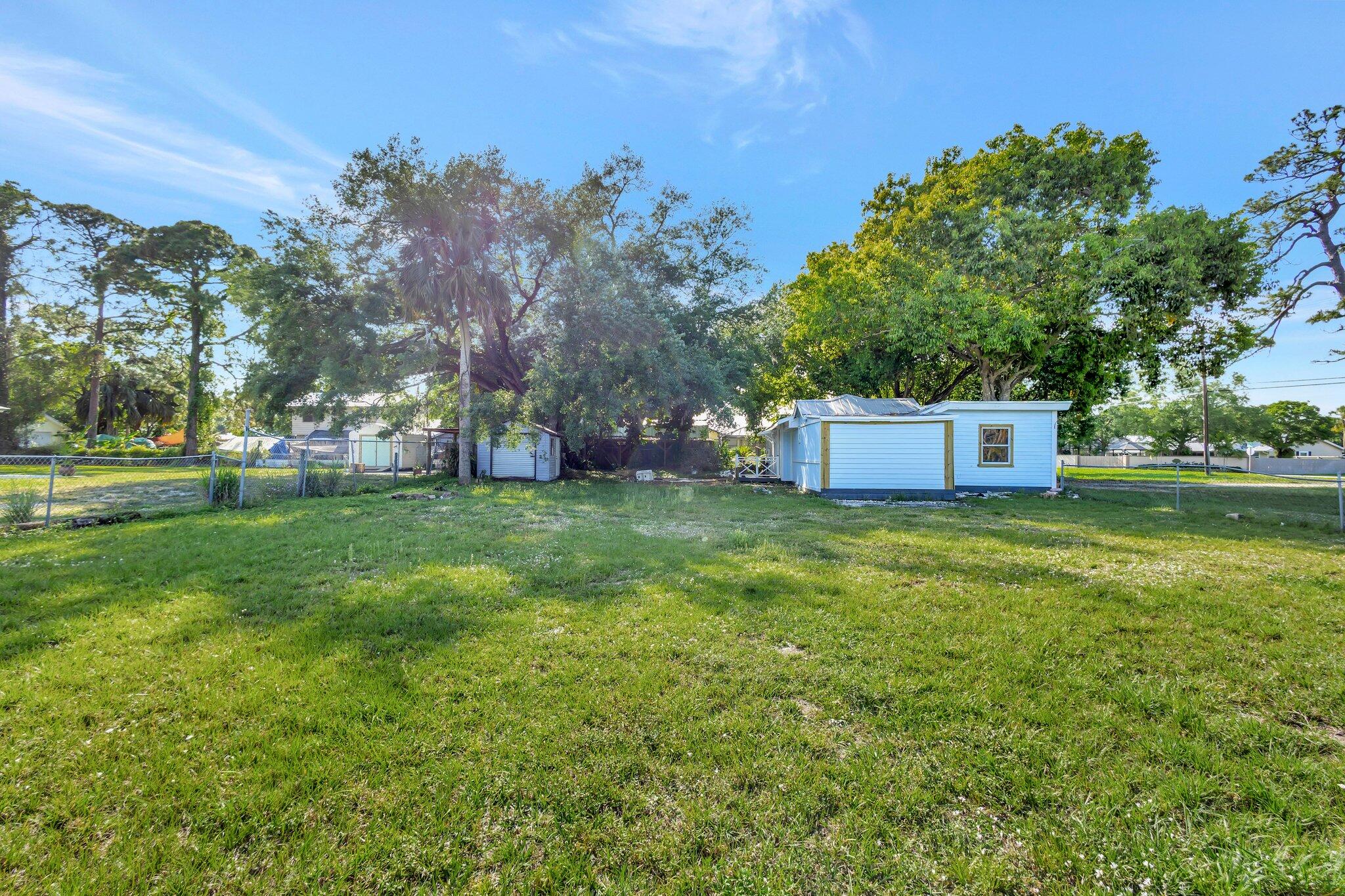 3539 Edwards Road Fort Pierce, FL 34981 - Photo 27 of 39 a fire hydrant in the middle of a field