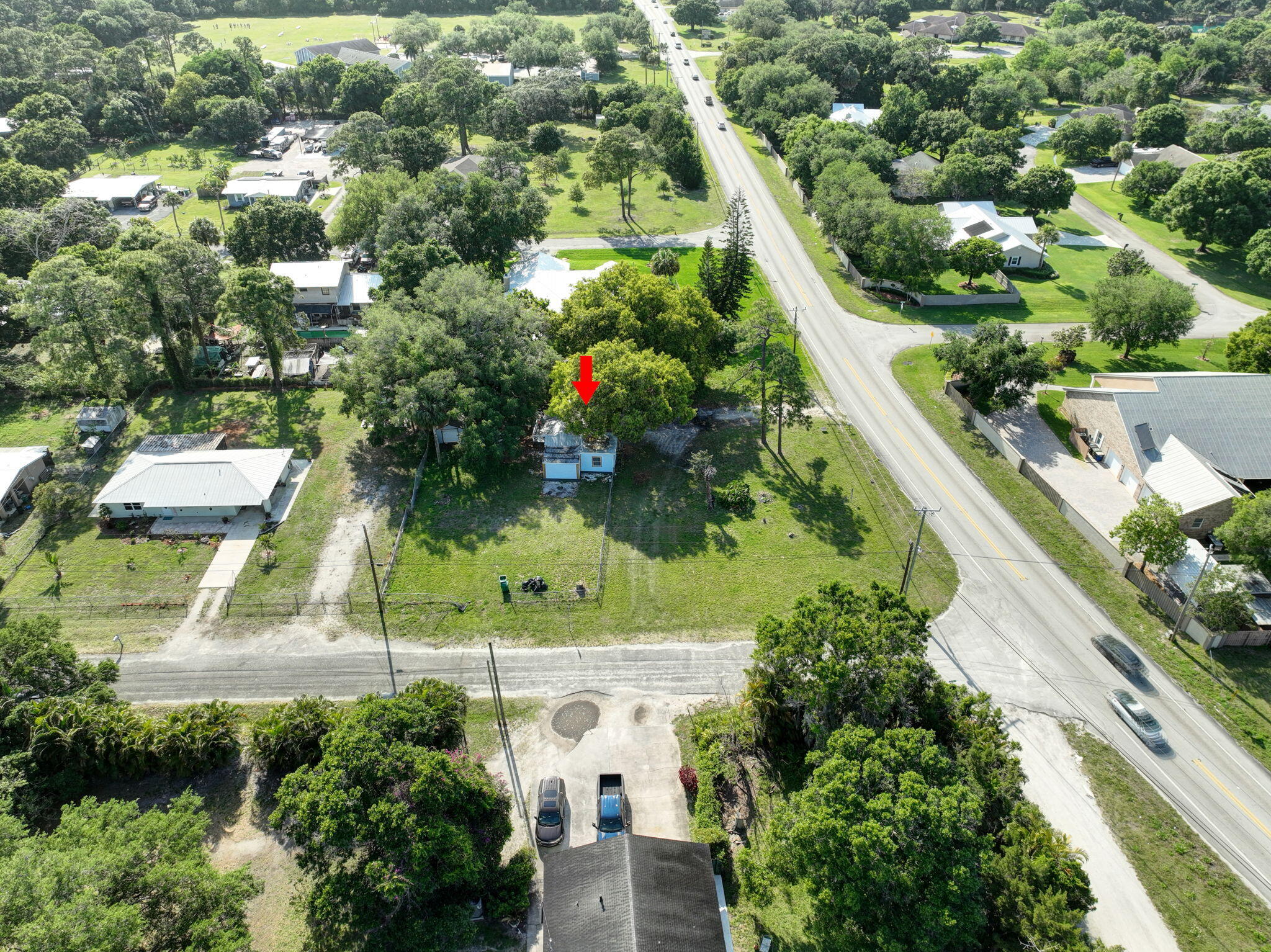 3539 Edwards Road Fort Pierce, FL 34981 - Photo 38 of 39 an aerial view of residential houses with outdoor space and trees all around