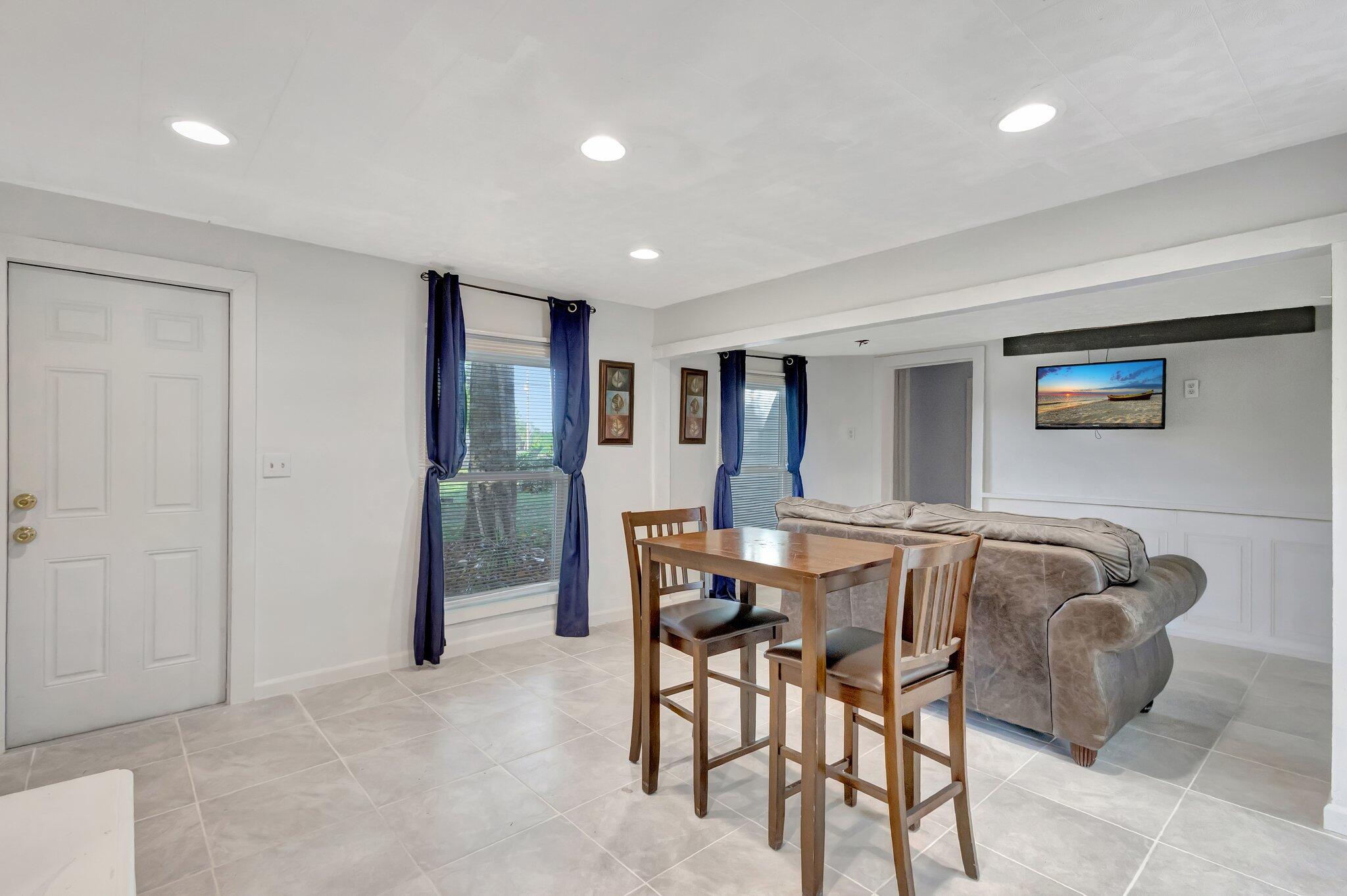3539 Edwards Road Fort Pierce, FL 34981 - Photo 5 of 39 a view of a dining room with furniture and window