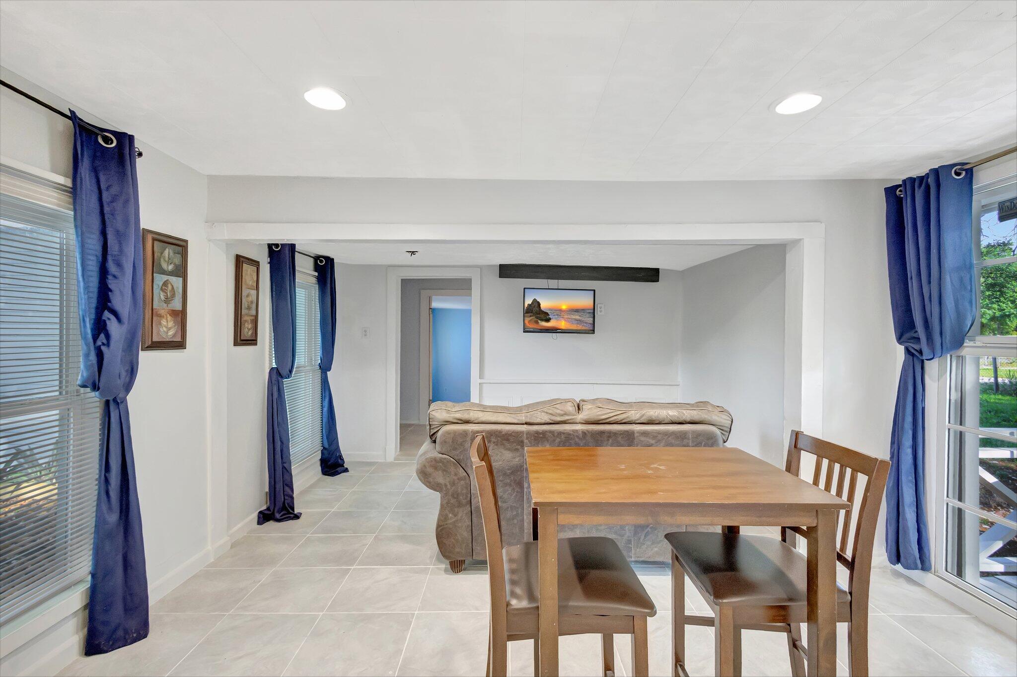 3539 Edwards Road Fort Pierce, FL 34981 - Photo 6 of 39 a view of a dining room with furniture and a chandelier