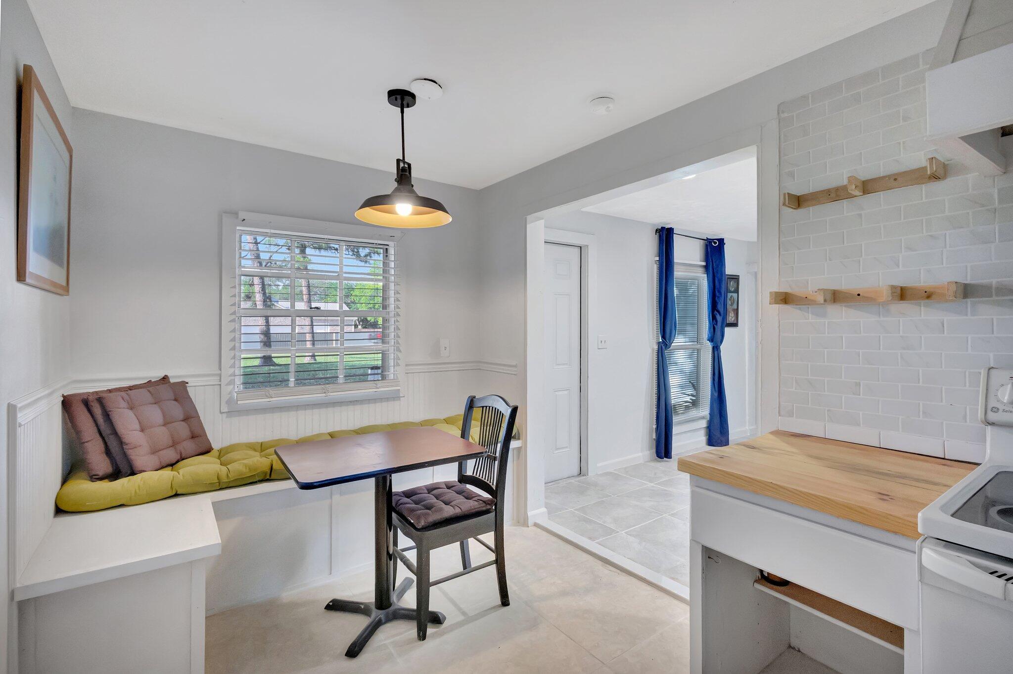 3539 Edwards Road Fort Pierce, FL 34981 - Photo 7 of 39 a dining room with furniture and a window