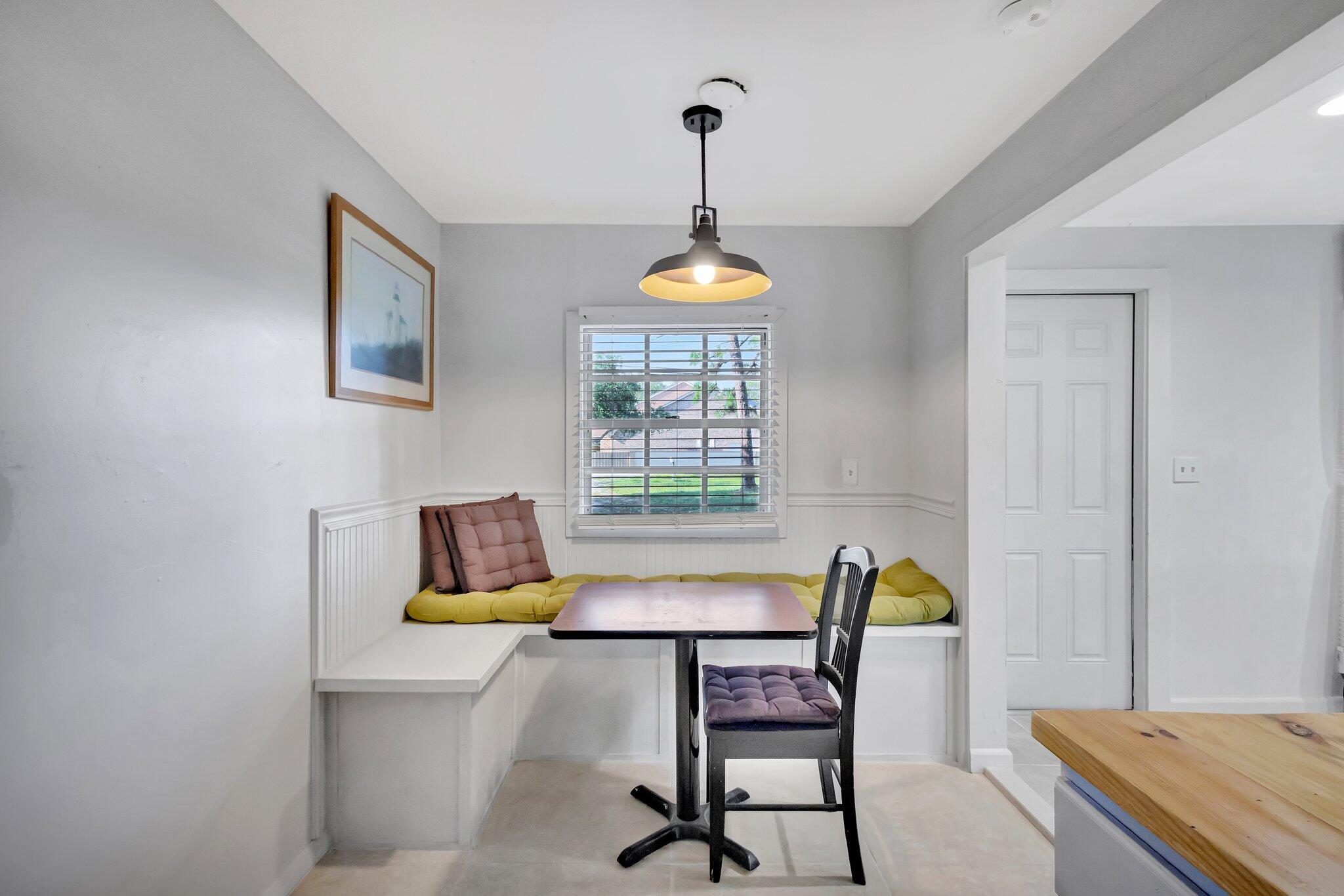 3539 Edwards Road Fort Pierce, FL 34981 - Photo 10 of 39 a view of a dining room with furniture and window