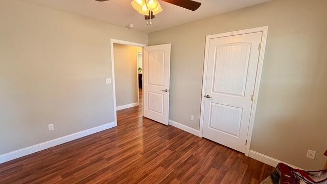 189 Foothills Drive Dayton, TN 37321 - Photo 13 of 18 an empty room with wooden floor closet and chandelier fan