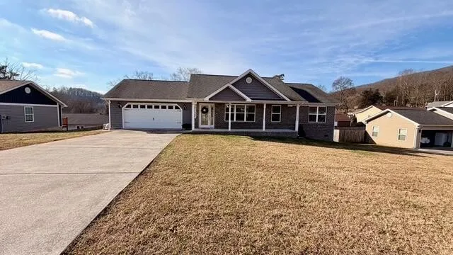 an aerial view of a house with a garden and sitting area