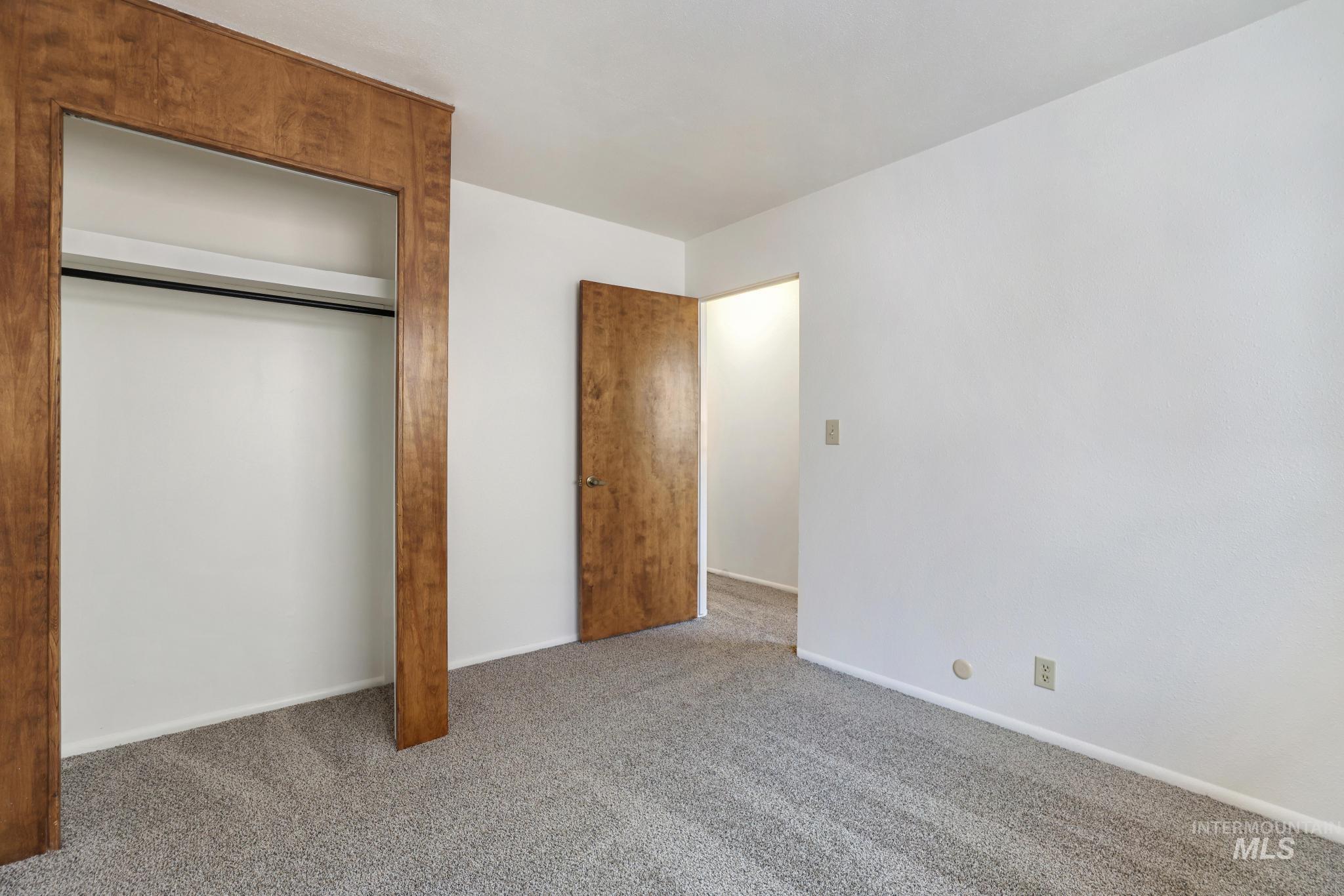 409 Clear Lakes Road Buhl, ID 83316 - Photo 17 of 43 Unfurnished bedroom featuring carpet and a closet