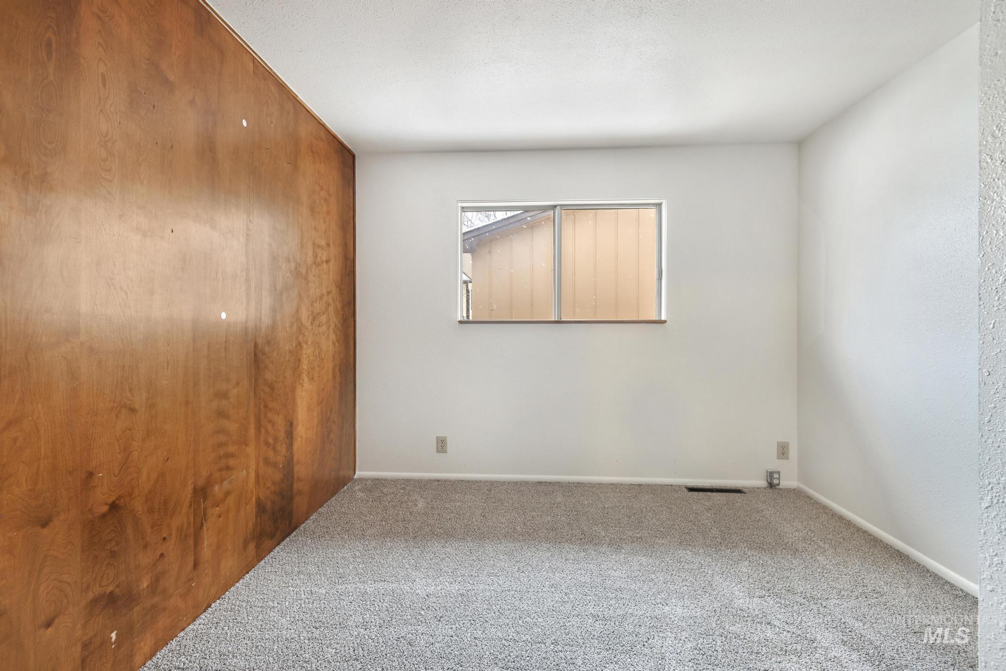 409 Clear Lakes Road Buhl, ID 83316 - Photo 20 of 23 Unfurnished bedroom featuring carpet and baseboards