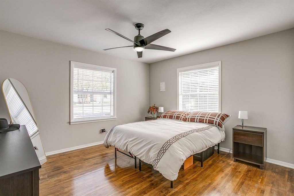 137 Merritt Street Fort Worth, TX 76114 - Photo 12 of 30 a bedroom with a bed and wooden floor