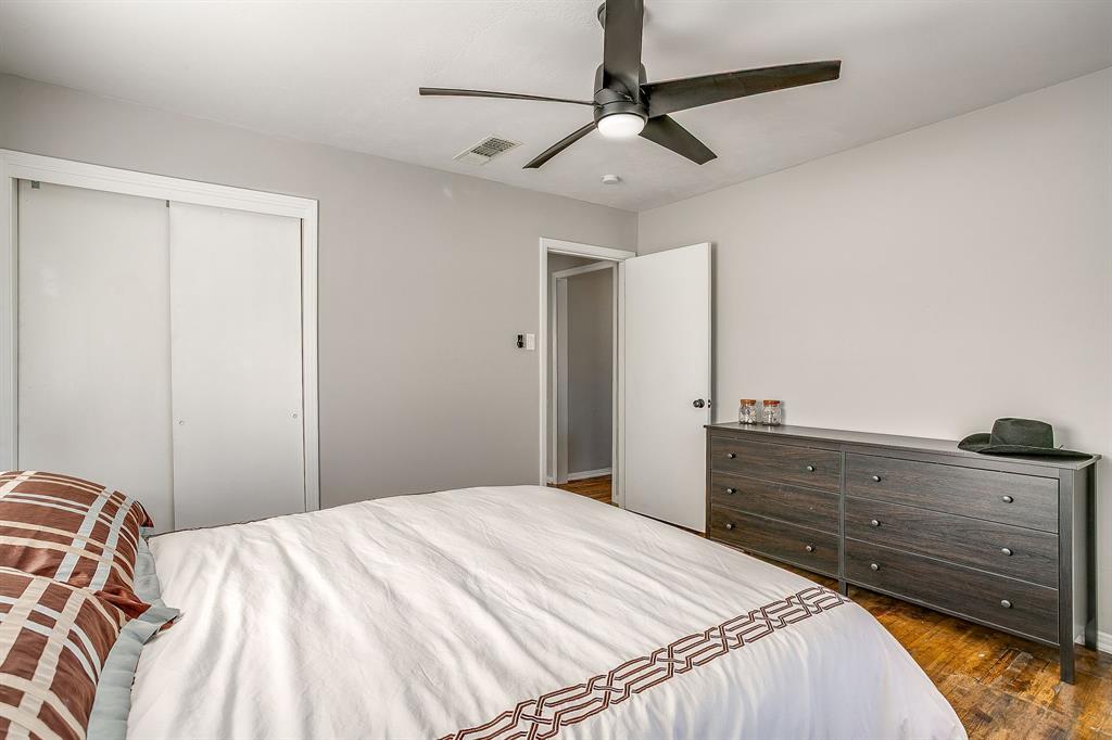 137 Merritt Street Fort Worth, TX 76114 - Photo 13 of 30 a bedroom with a bed and a dresser