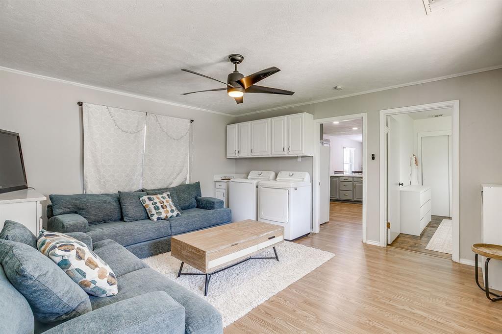 137 Merritt Street Fort Worth, TX 76114 - Photo 20 of 30 a living room with furniture and a wooden floor