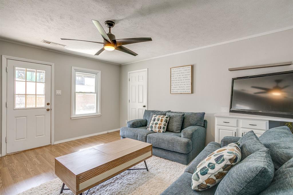 137 Merritt Street Fort Worth, TX 76114 - Photo 22 of 30 a living room with furniture and a flat screen tv