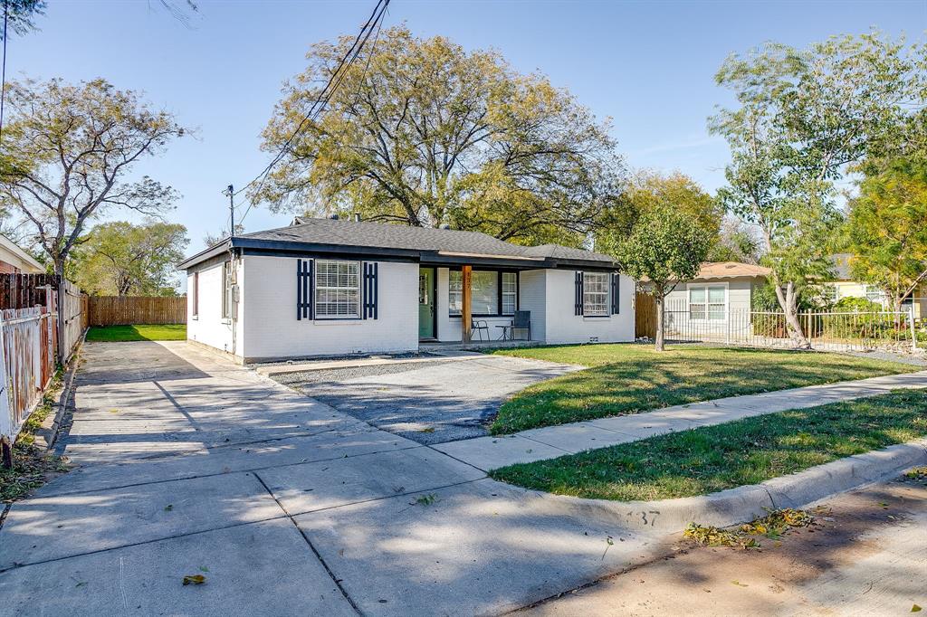 137 Merritt Street Fort Worth, TX 76114 - Photo 25 of 30 a front view of a house with a garden and trees