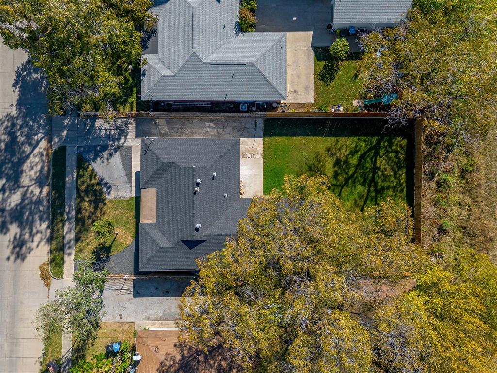 137 Merritt Street Fort Worth, TX 76114 - Photo 26 of 30 an aerial view of a house with a yard and trees all around