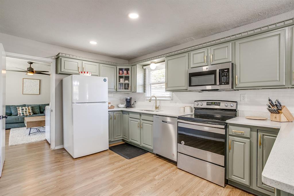 137 Merritt Street Fort Worth, TX 76114 - Photo 7 of 30 a kitchen with a refrigerator stove and microwave