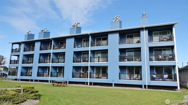 a front view of building with yard