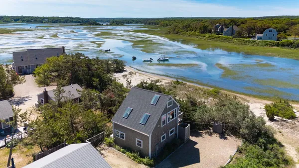 an aerial view of residential houses with outdoor space