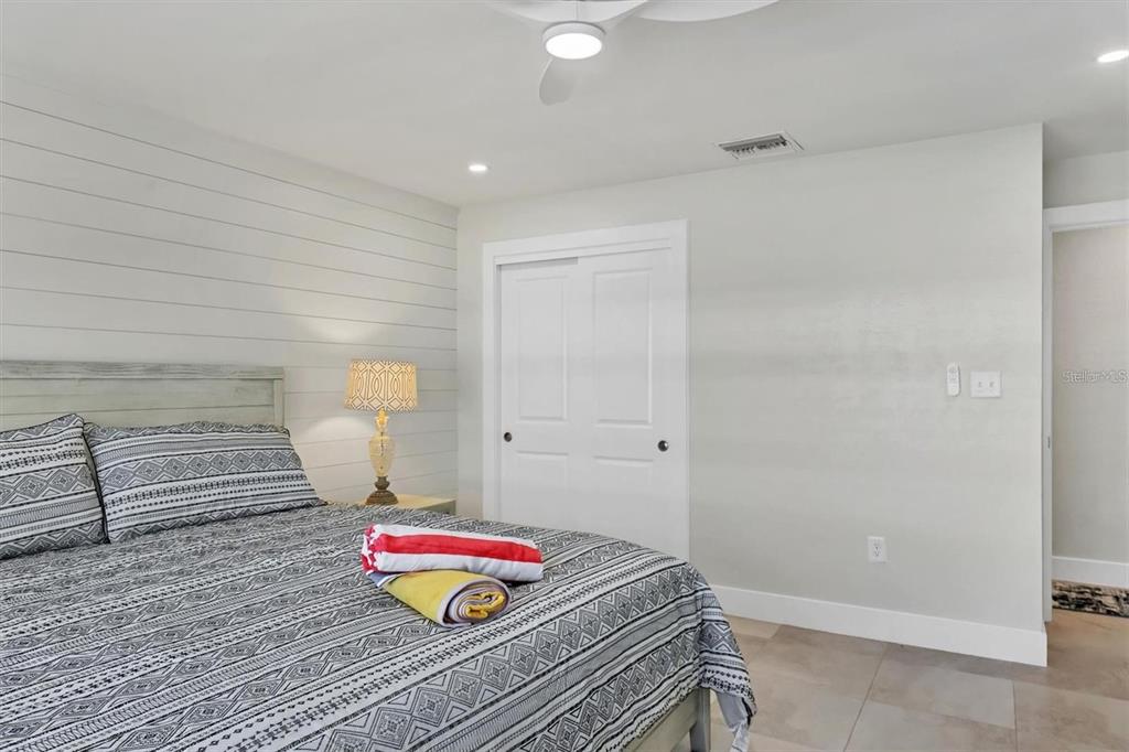 5830 Midnight Pass Road, Unit 54 Sarasota, FL 34242 - Photo 13 of 36 a living room with a couch