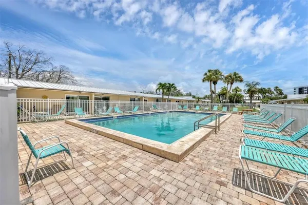 a view of swimming pool with a lounge chair
