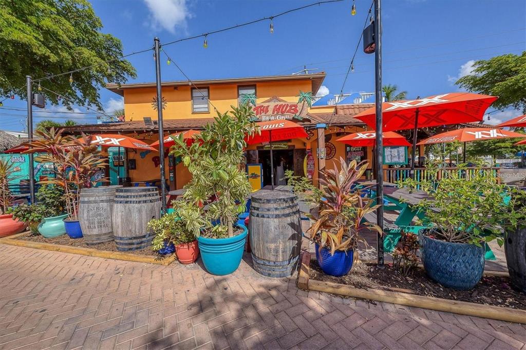 5830 Midnight Pass Road, Unit 54 Sarasota, FL 34242 - Photo 27 of 36 a view of a chairs and tables in patio