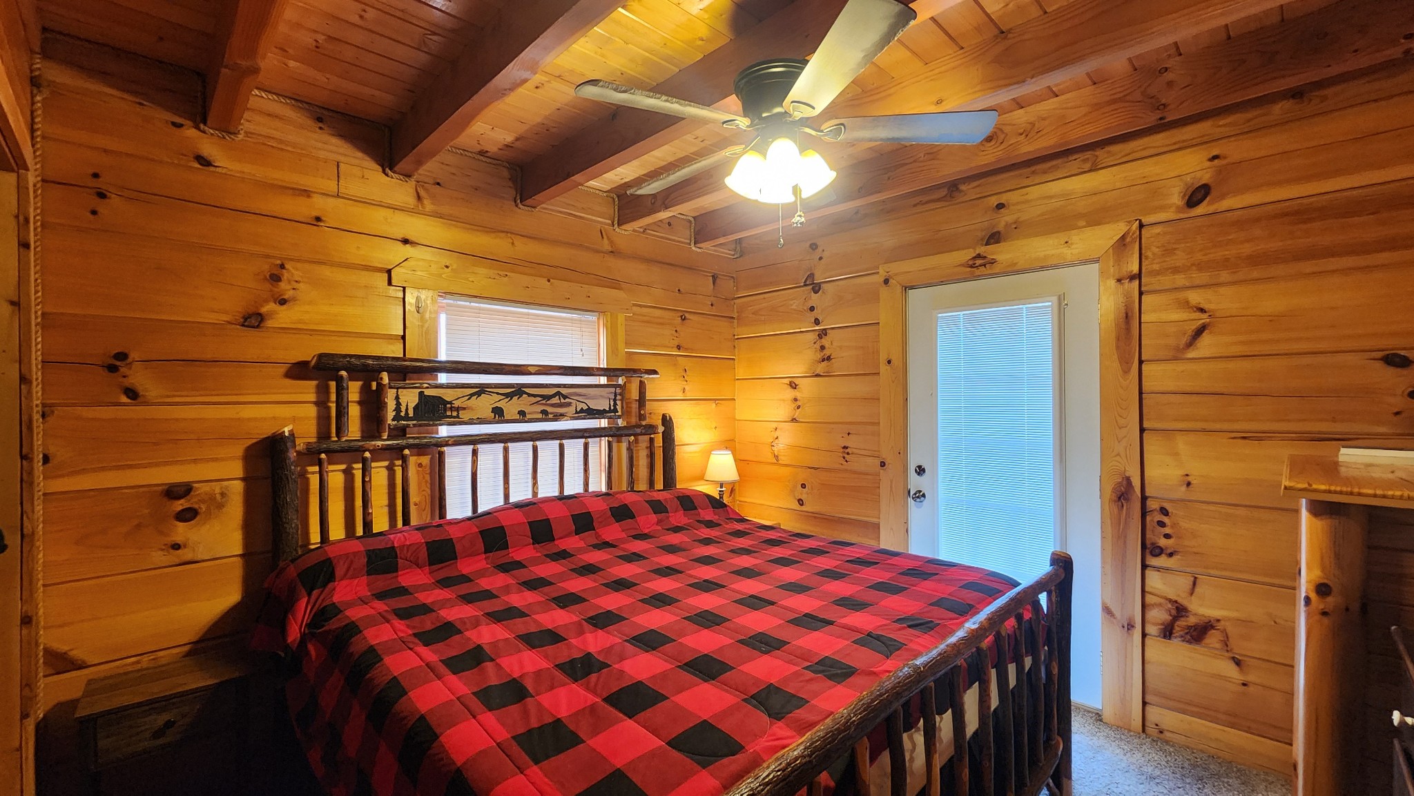 5615 Eastport Road Alpine, TN 38543 - Photo 5 of 83 a bedroom with a bed and a table