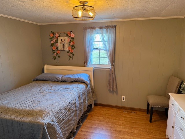 245 Cortner Mill Road Normandy, TN 37360 - Photo 12 of 40 a bedroom with a bed and a painting on the wall