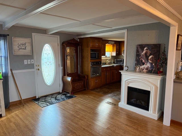245 Cortner Mill Road Normandy, TN 37360 - Photo 15 of 40 a view of a livingroom with furniture wooden floor and a fireplace