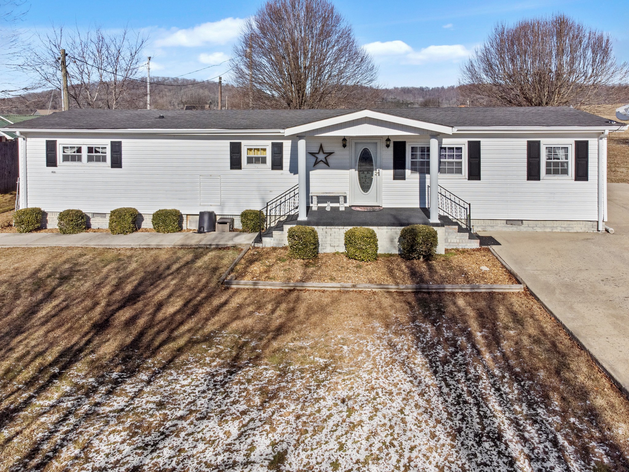245 Cortner Mill Road Normandy, TN 37360 - Photo 2 of 40 a view of a white house with a yard and balcony