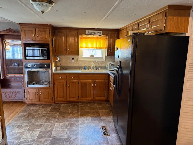 245 Cortner Mill Road Normandy, TN 37360 - Photo 22 of 40 a kitchen with a sink appliances and cabinets