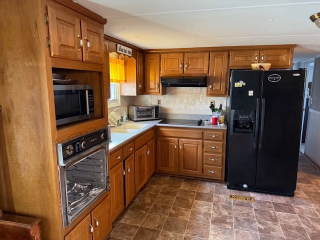 245 Cortner Mill Road Normandy, TN 37360 - Photo 24 of 40 a kitchen with stainless steel appliances granite countertop a refrigerator and a stove top oven