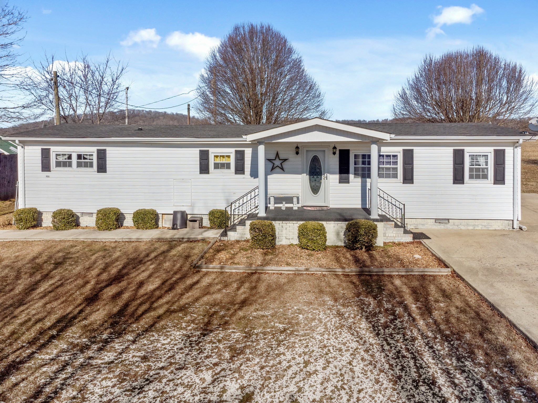 245 Cortner Mill Road Normandy, TN 37360 - Photo 38 of 40 a front view of a house with a yard covered with snow in front of house