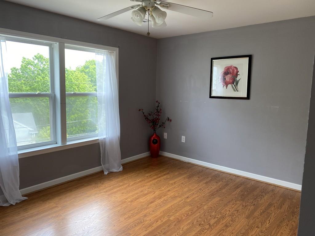 1 Arrowsic Street Worcester, MA 01606 - Photo 15 of 19 a view of an empty room with a window and wooden floor