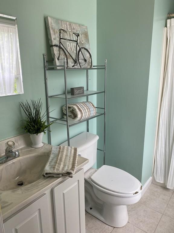 1 Arrowsic Street Worcester, MA 01606 - Photo 16 of 19 a bathroom with a granite countertop toilet and a sink