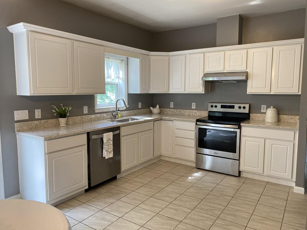 1 Arrowsic Street Worcester, MA 01606 - Photo 5 of 19 a kitchen with cabinets appliances and a sink