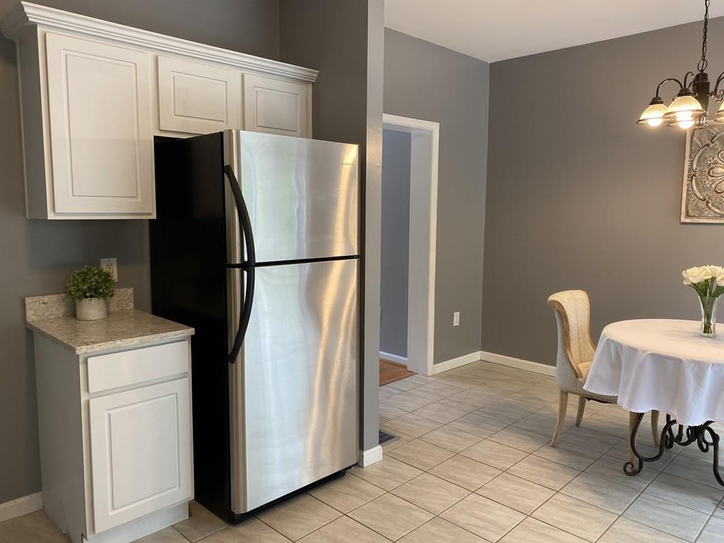 1 Arrowsic Street Worcester, MA 01606 - Photo 7 of 19 a white refrigerator freezer sitting in a kitchen