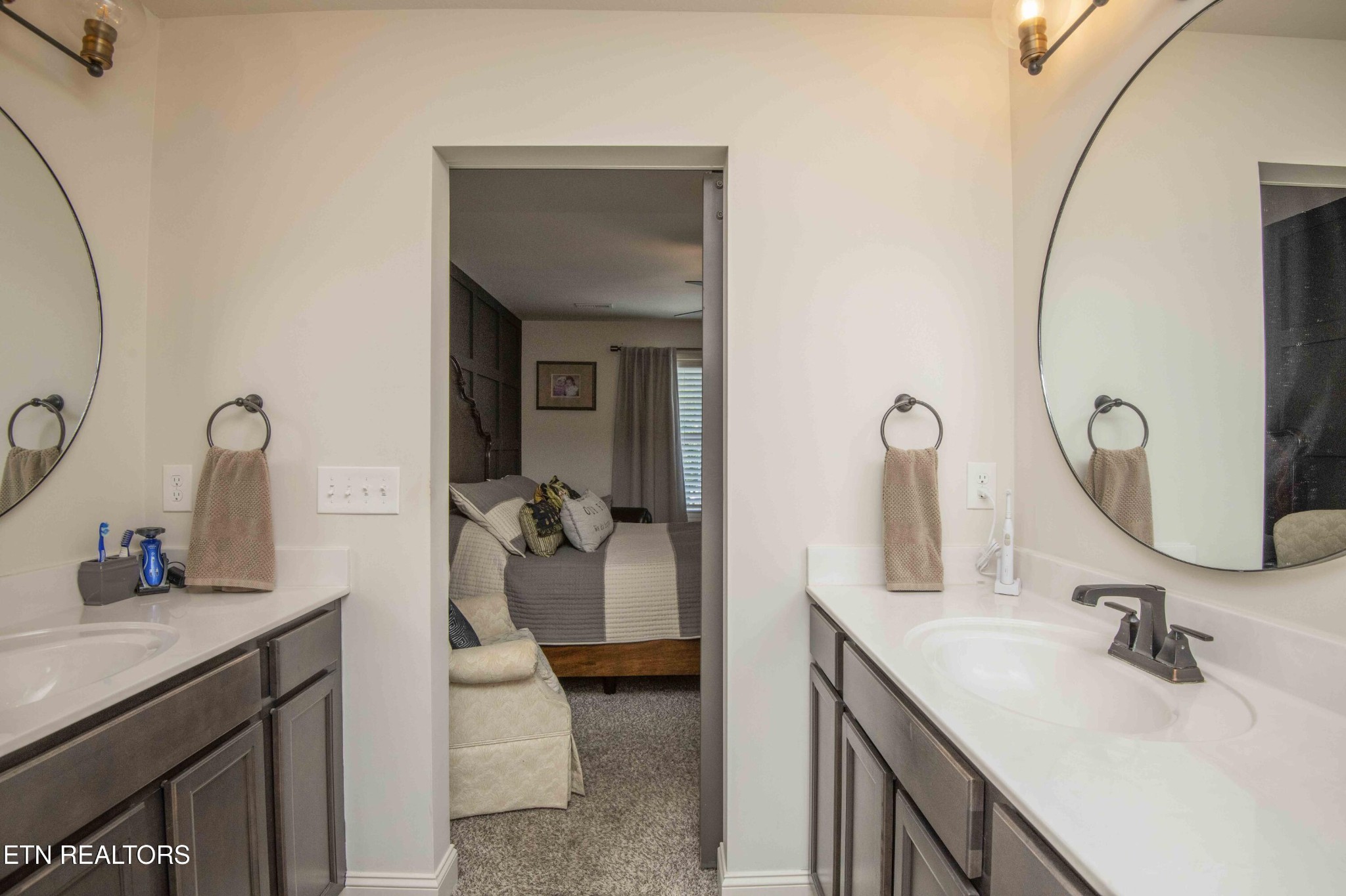 8320 Day Valley Road Powell, TN 37849 - Photo 22 of 35 a en suite bathroom with a double vanity sink and a mirror