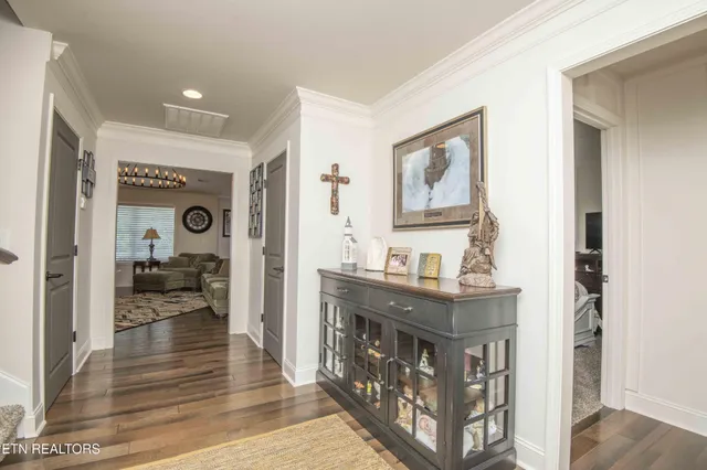 a view of a hallway view with living room and furniture