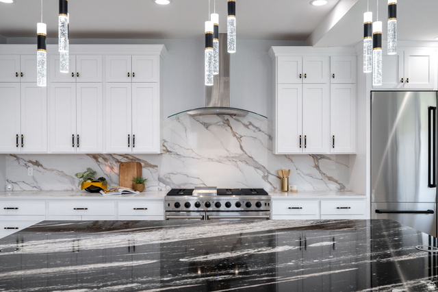 476 Spring Drive Toquerville, UT 84774 - Photo 17 of 95 Kitchen featuring dark stone counters, white cabinets, high quality appliances, decorative light fixtures, and decorative backsplash