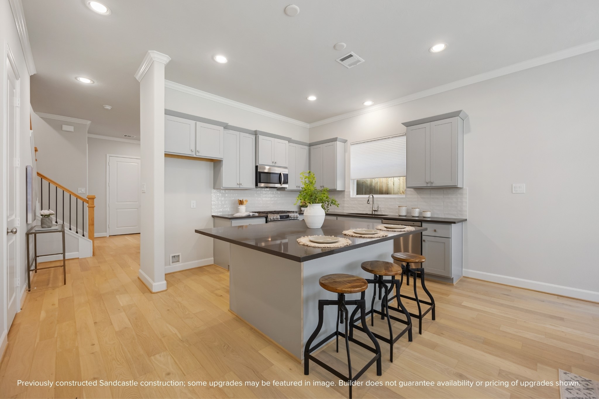 4317 Roseland Street, Unit B Houston, TX 77006 - Photo 5 of 36 a kitchen with a sink a counter top space appliances and cabinets