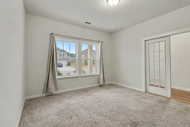 an empty room with windows