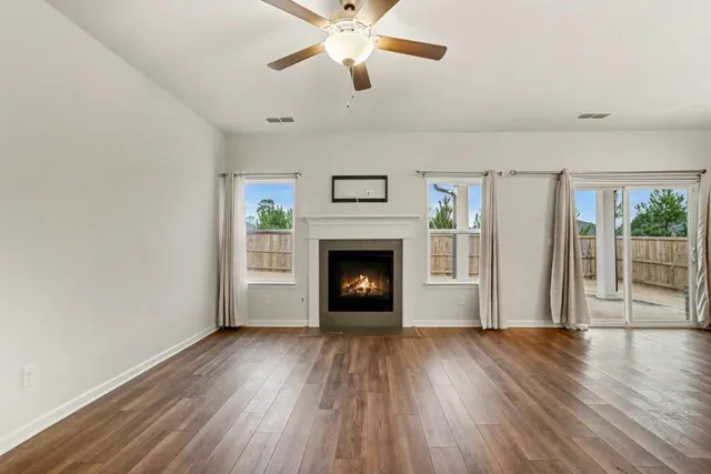 a view of kitchen with kitchen island wooden floor center island and appliances
