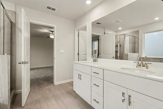 a bathroom with a bathtub and a shower