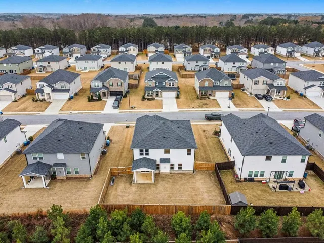 a view of a swimming pool with lounge chair