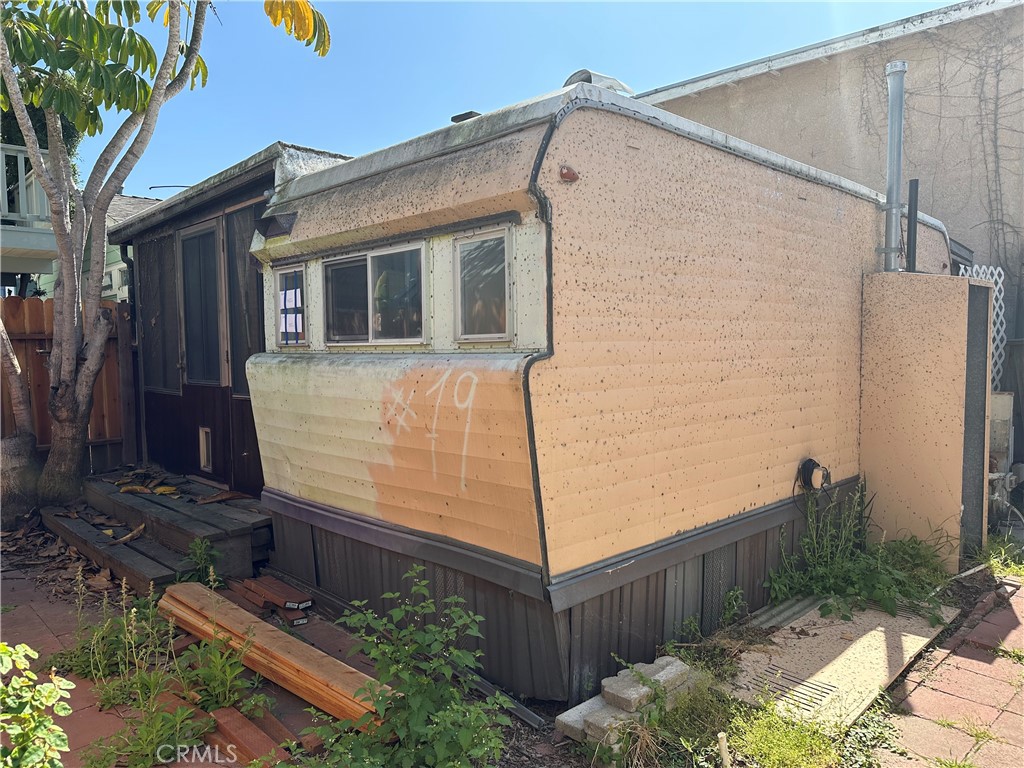 a view of a house with wooden fence