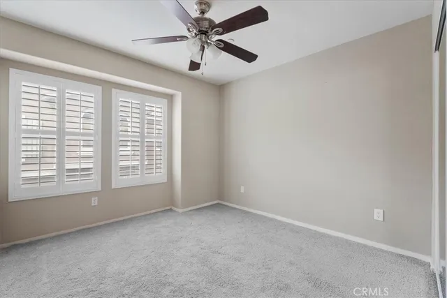 a spacious bathroom with a double vanity sink and a mirror