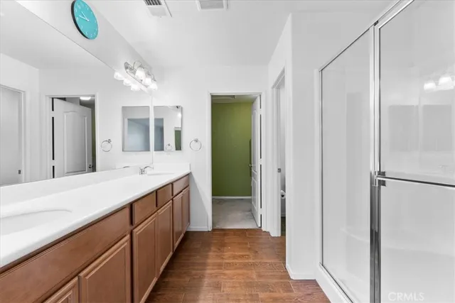 a bathroom with a sink double vanity and a mirror