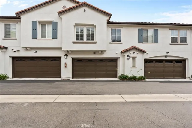 a front view of a house with a garage
